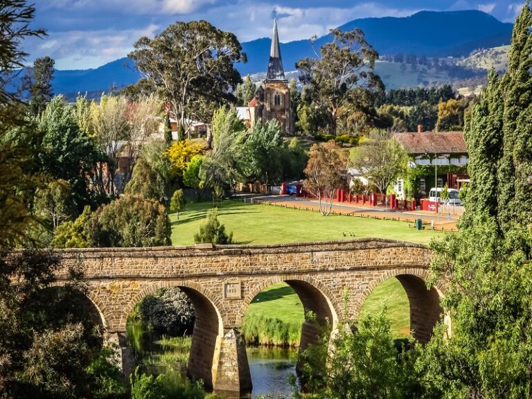 Historic Richmond Bridge in Tasmania with church in background