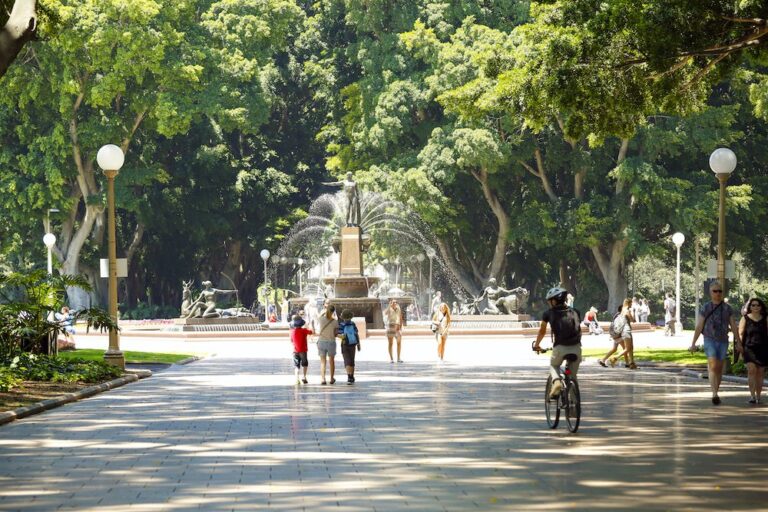 People strolling near the Archibald Fountain in Hyde Park, Sydney.