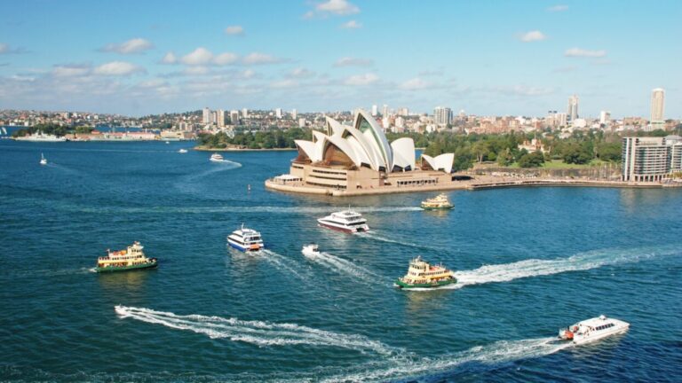 Sydney Opera House with boats in the harbor