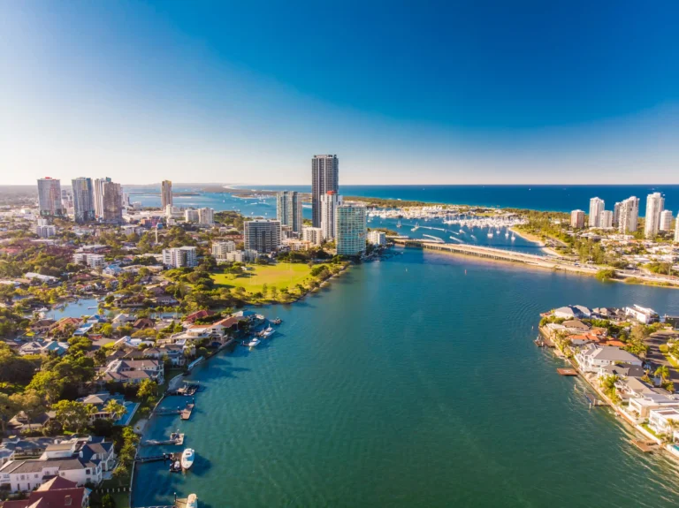 Aerial view of Gold Coast waterfront with skyscrapers and marina.