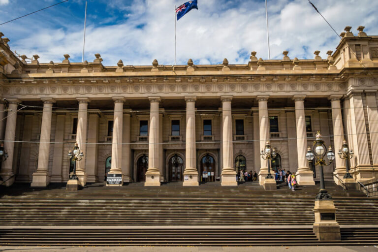 Front view of Parliament House in Melbourne with columns and steps
