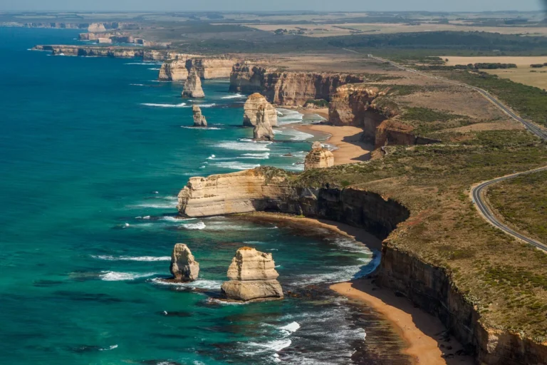 Aerial view of the Twelve Apostles rock formations along the Great Ocean Road.