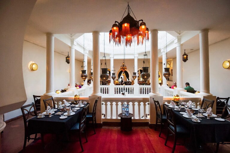 Elegant Moroccan restaurant interior with lanterns and columns