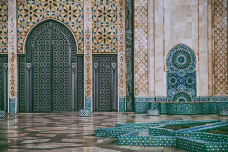 Intricate tilework and architecture at Hassan II Mosque in Morocco.