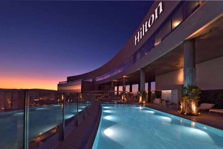 Hilton hotel rooftop pool at sunset in Morocco