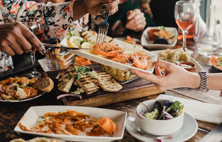 Group enjoying a seafood dinner in South Africa