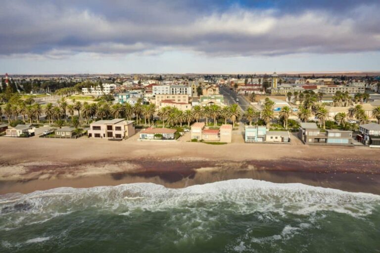 Aerial view of Swakopmund beachfront with ocean and palm trees