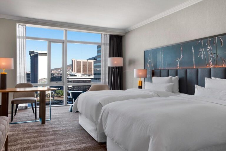 Modern hotel room with city view in South Africa.