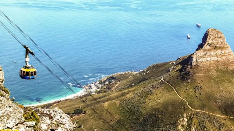 Cable car ascending Table Mountain with ocean view