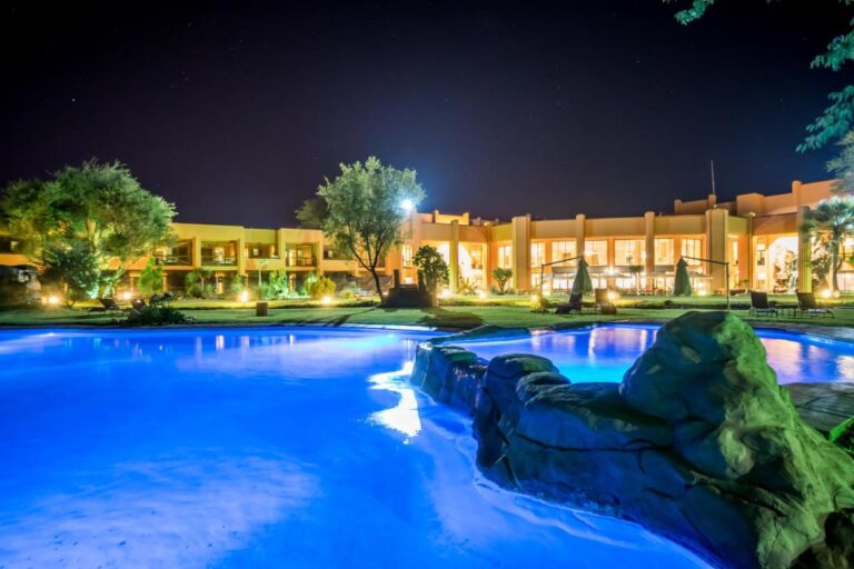 Night view of Windhoek Country Club with illuminated pool