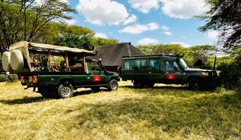 Safari vehicles parked at Keekorok Lodge in Maasai Mara.