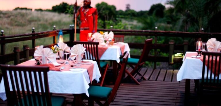 Outdoor dining setup on a wooden deck in Kenya.