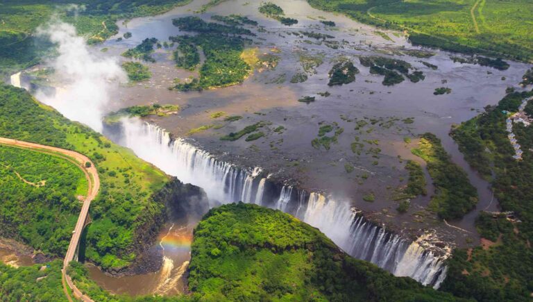 Aerial view of Victoria Falls with a rainbow.