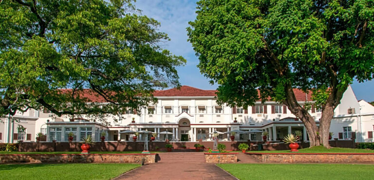 Colonial-style luxury resort in Victoria Falls with lush gardens