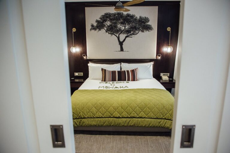 Cozy hotel room with green bedding at Mowana Hotel