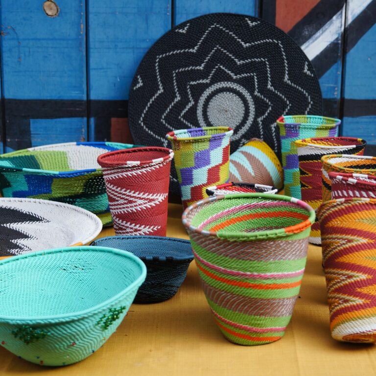 Colorful woven baskets at a Zambian market.