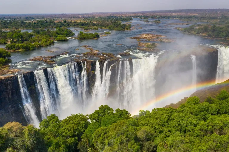 Aerial view of Victoria Falls with a rainbow.