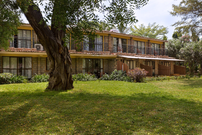 Hotel building with garden and trees in East Africa