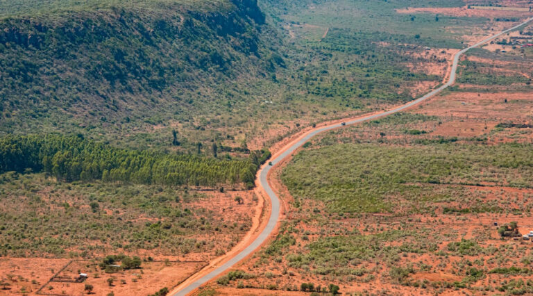 Scenic view of the Great Rift Valley in Kenya with a winding road.