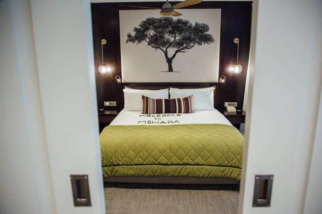 Cozy hotel room with green bedding at Mowana Hotel