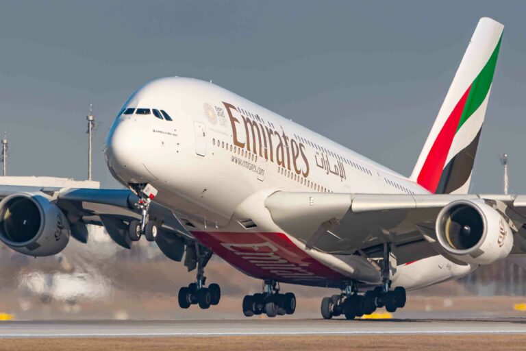 Emirates Airbus A380 taking off from runway.