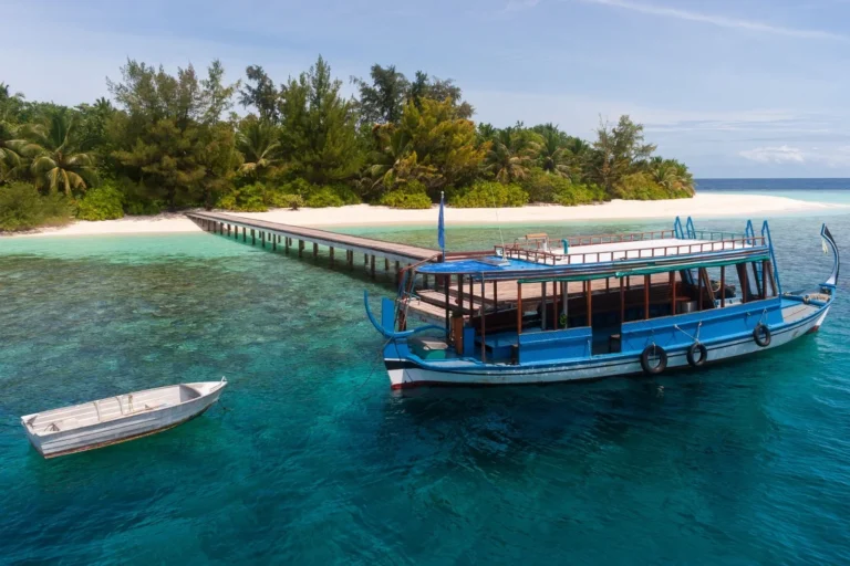Traditional boat docked at a tropical island in the Maldives