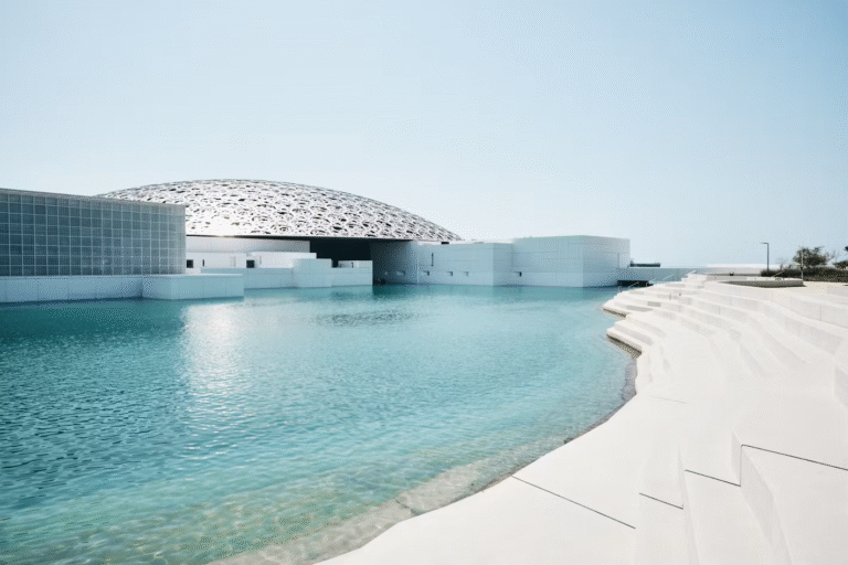 Modern architecture of Louvre Abu Dhabi with dome over water