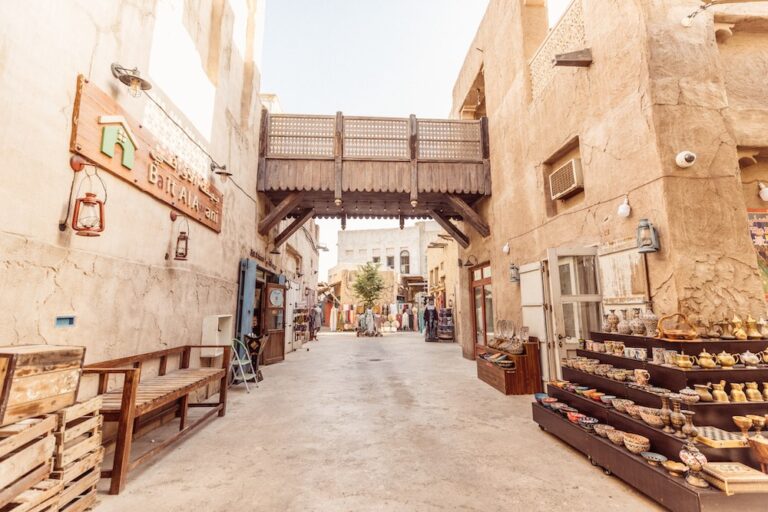 Traditional market at UAE Heritage Village with pottery display.