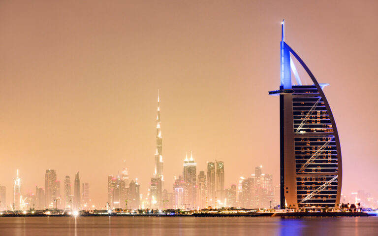 Burj Al Arab and Dubai skyline at night