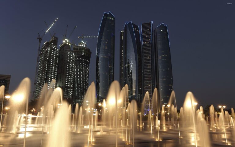 Etihad Towers and fountains at night in Abu Dhabi