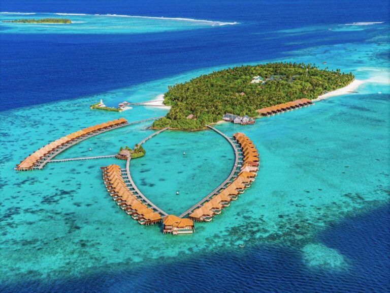 Aerial view of overwater bungalows in the Maldives