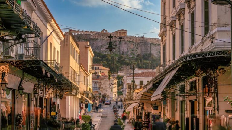 Street view of Plaka with Acropolis in the background