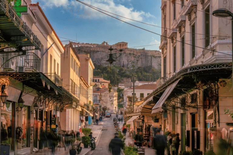 Bustling street in Athens with the Acropolis in the background