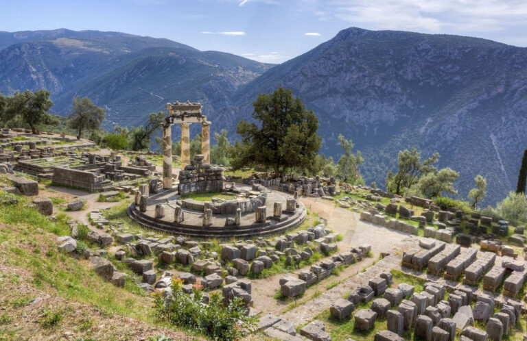Ruins of the Temple of Apollo at Delphi with mountains in the background