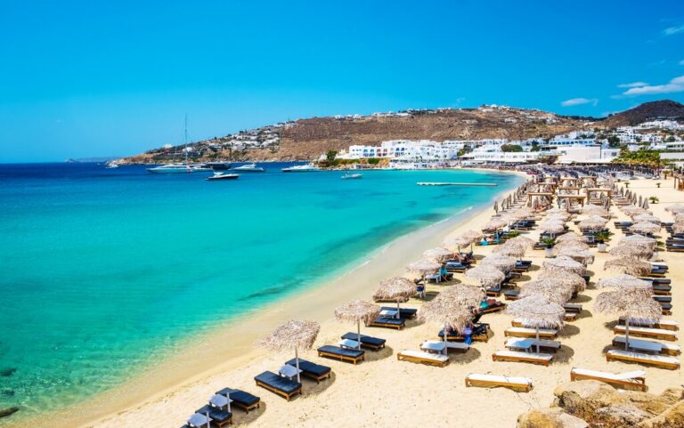 Mykonos beach with umbrellas and sunbeds
