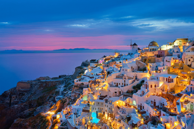 Santorini sunset with white buildings and sea view