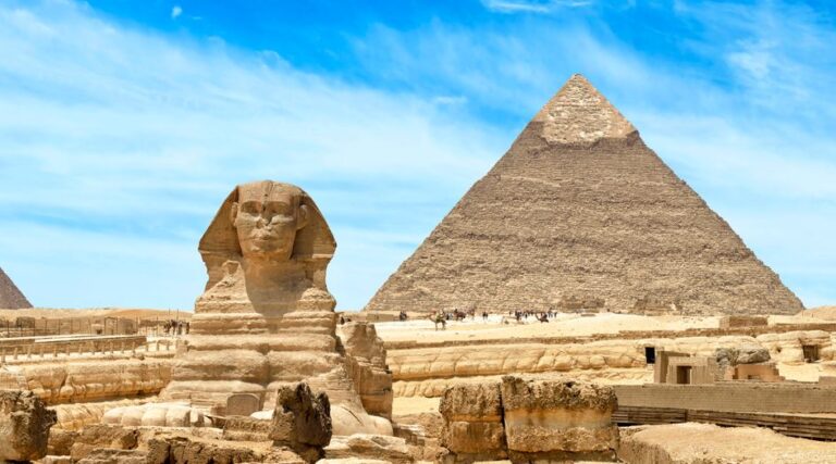 The Great Sphinx and Pyramid of Giza under a clear sky