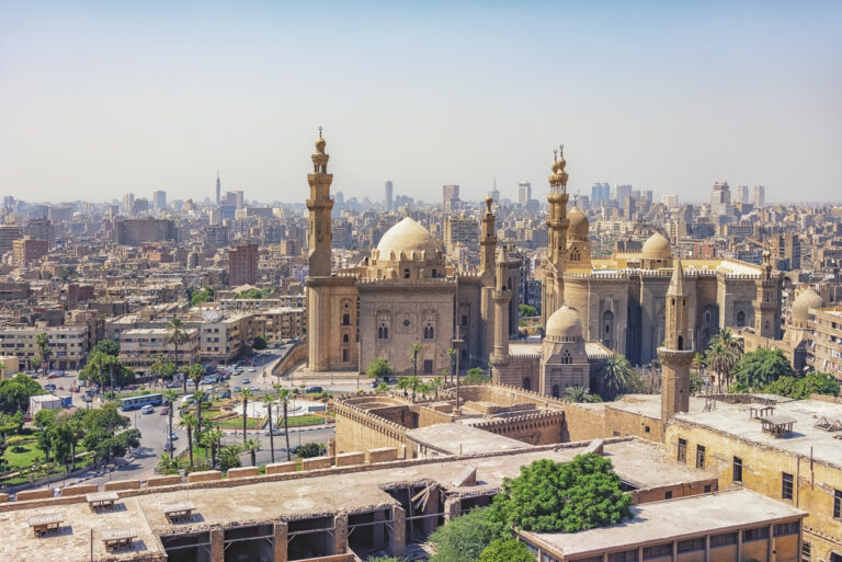 Sultan Hassan and Al-Rifa'i Mosques in Cairo cityscape