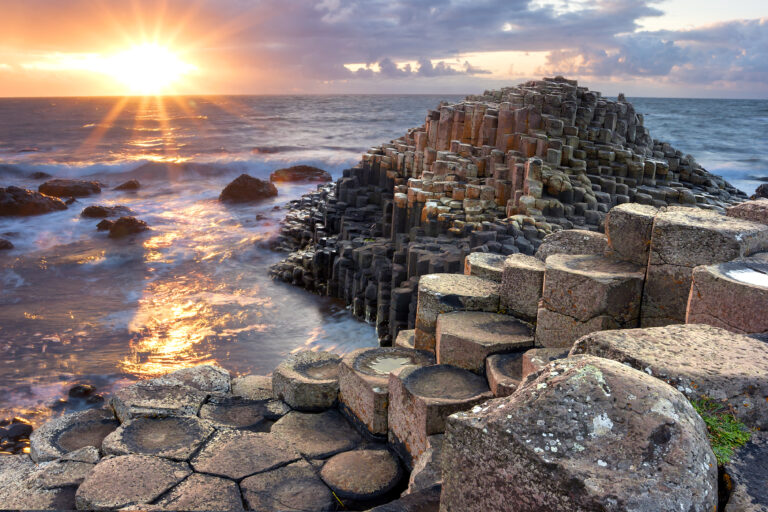 Giant's Causeway basalt columns at sunset.
