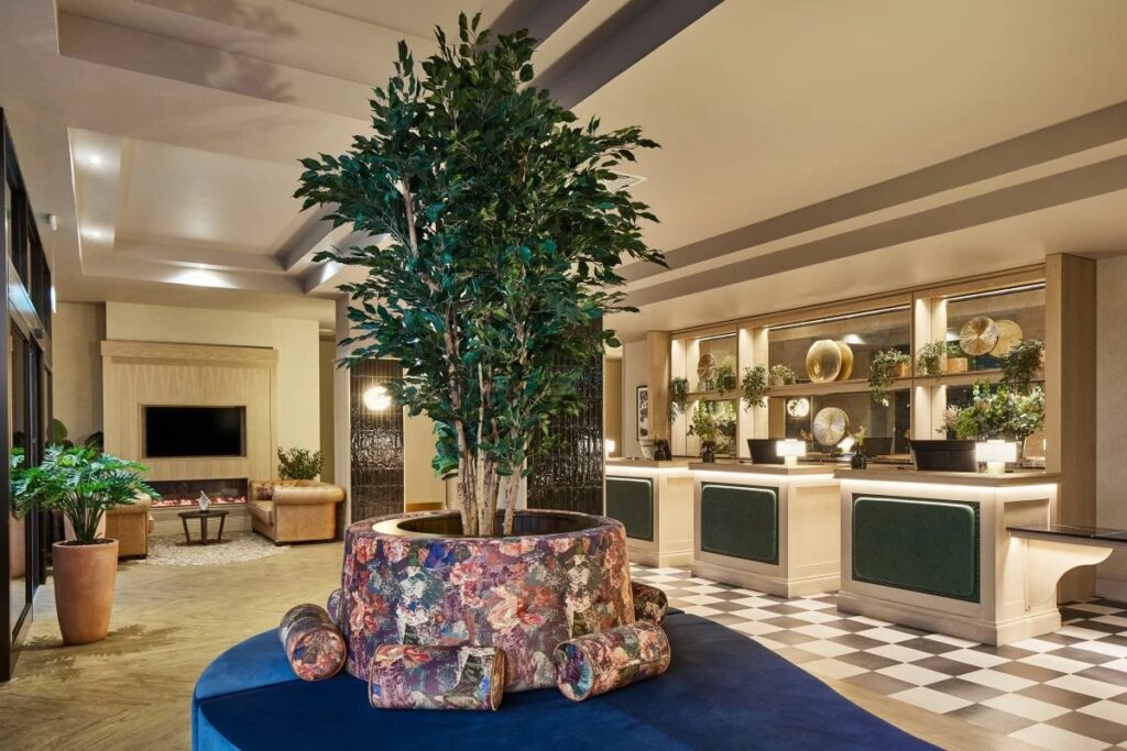 Lobby of Leonardo Hotel in Edinburgh with plants and seating.
