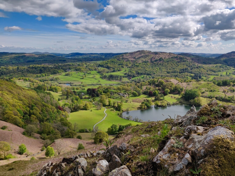 Scenic view of Lake District landscape with hills and lake.