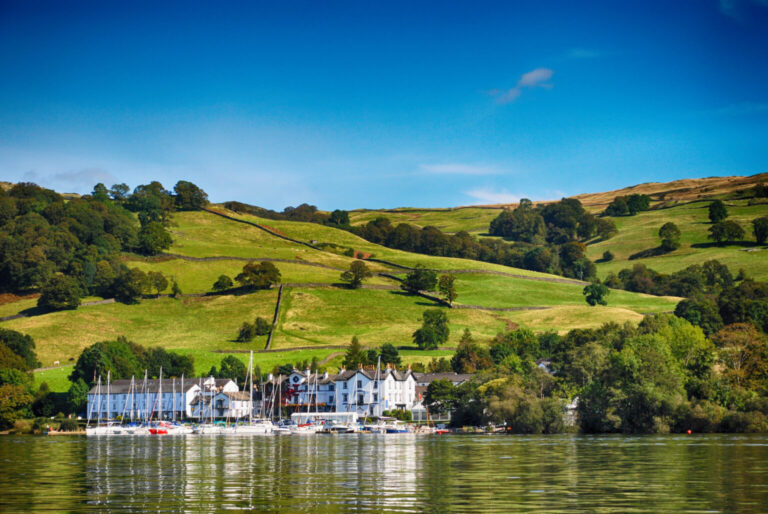 Scenic view of Lake Windermere with boats and hills