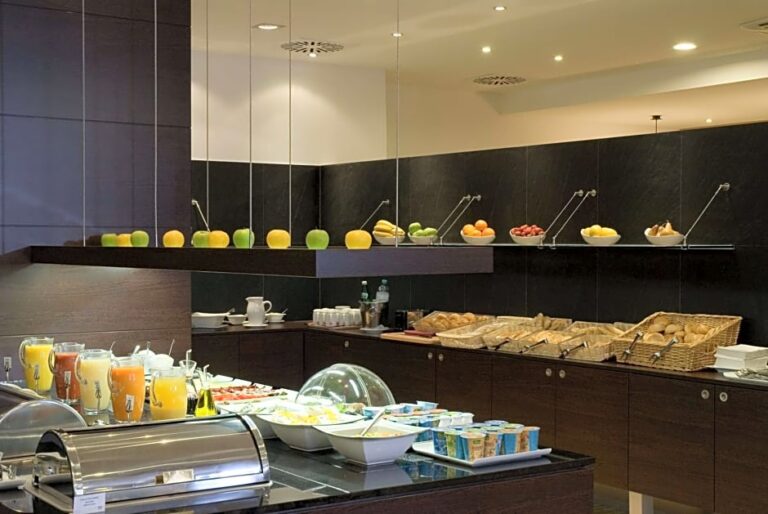 Hotel breakfast buffet in Vienna with various food options.