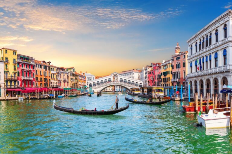 Gondolas on the Grand Canal in Venice with Rialto Bridge