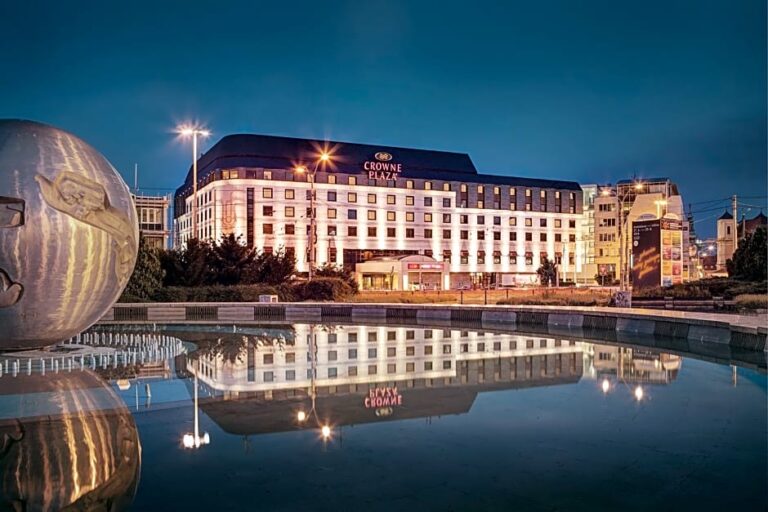 Crowne Plaza Hotel in Bratislava at night with reflections.