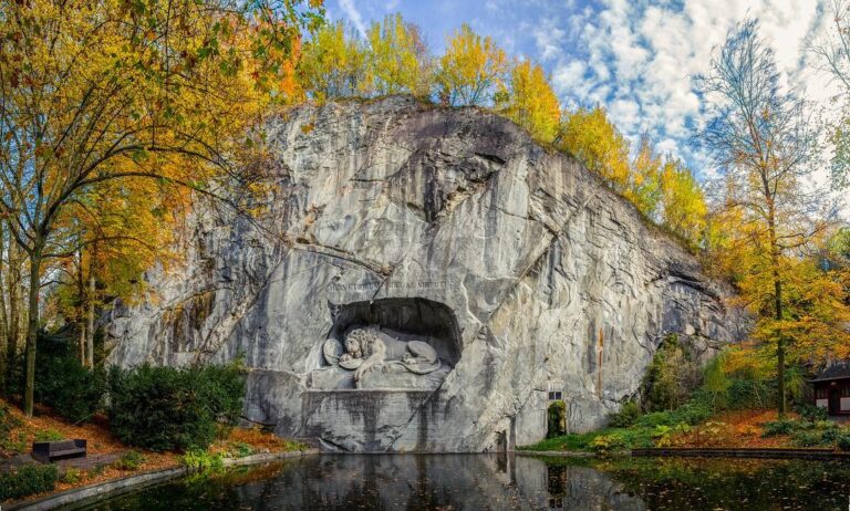 Lion Monument carved into rock in autumn, Lucerne.