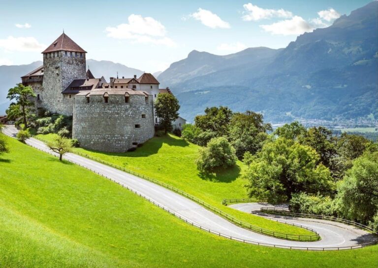 Vaduz Castle with Alpine mountains in background