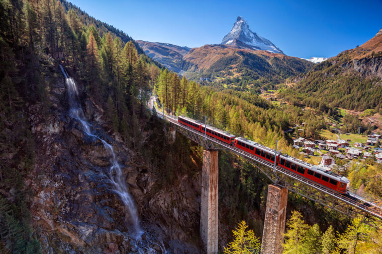 Train crossing a bridge near the Matterhorn in Zermatt.