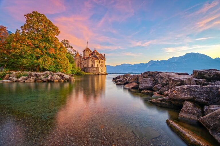 Chillon Castle by Lake Geneva at sunset in autumn.