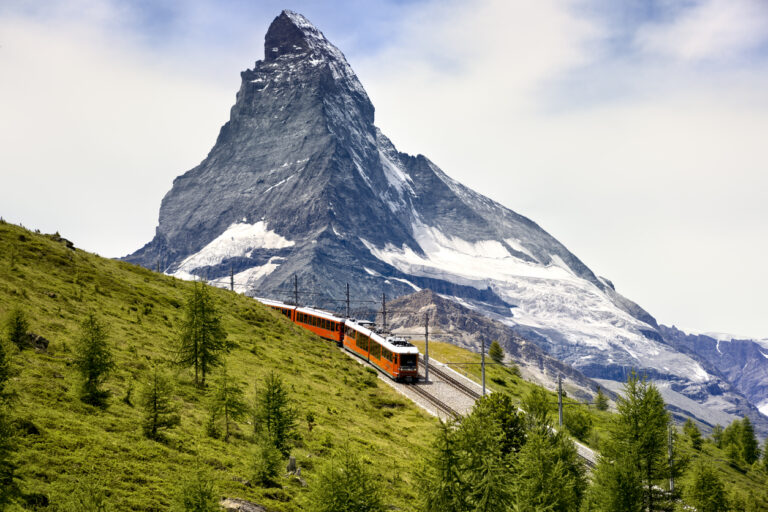 Train passing in front of the Matterhorn in Switzerland